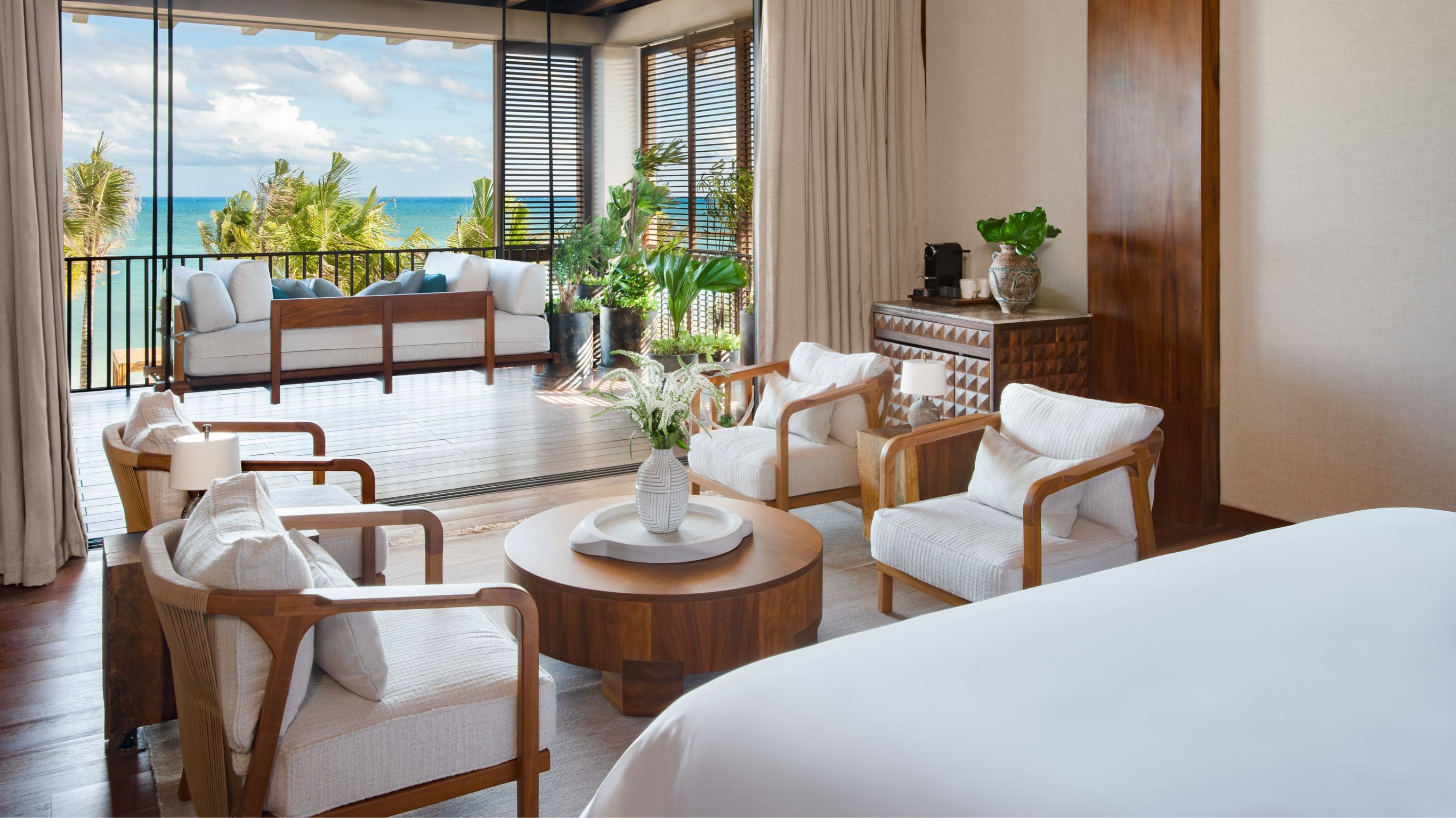 Beachfront Villa_Second Master Bedroom with king bed and sitting area view looking out onto private terrace overlooking beach and sea